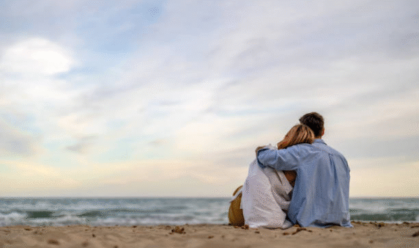 couple-looking-to-the-horizon-at